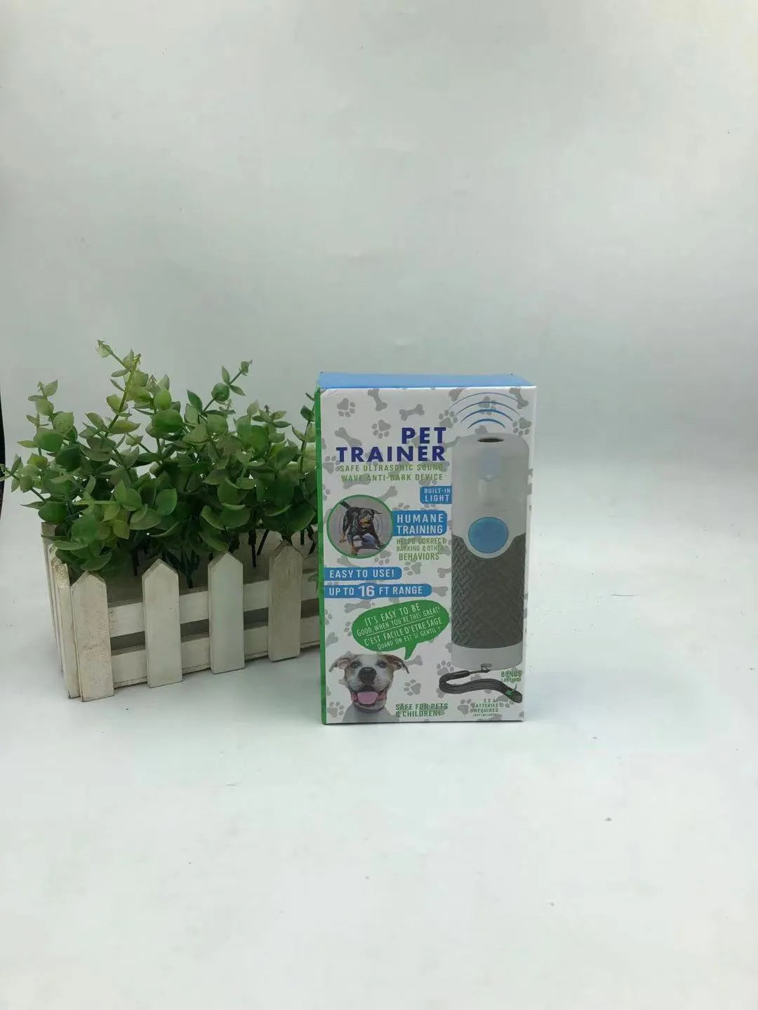 White handheld ultrasonic dog bark control trainer with ABS plastic housing