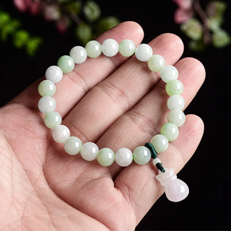 Jade purse bracelet with 8mm floral beads on wrist, traditional Chinese unisex design