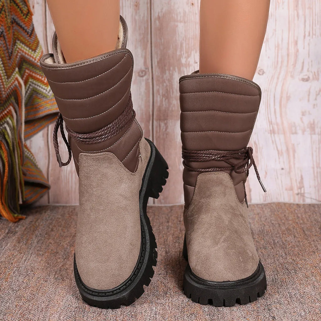 Women's black suede high-top winter boots with a chunky heel and lace-up front, fleece-lined.