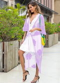 Light purple women's beach dress with lace embroidery, worn as a swimsuit cover-up.