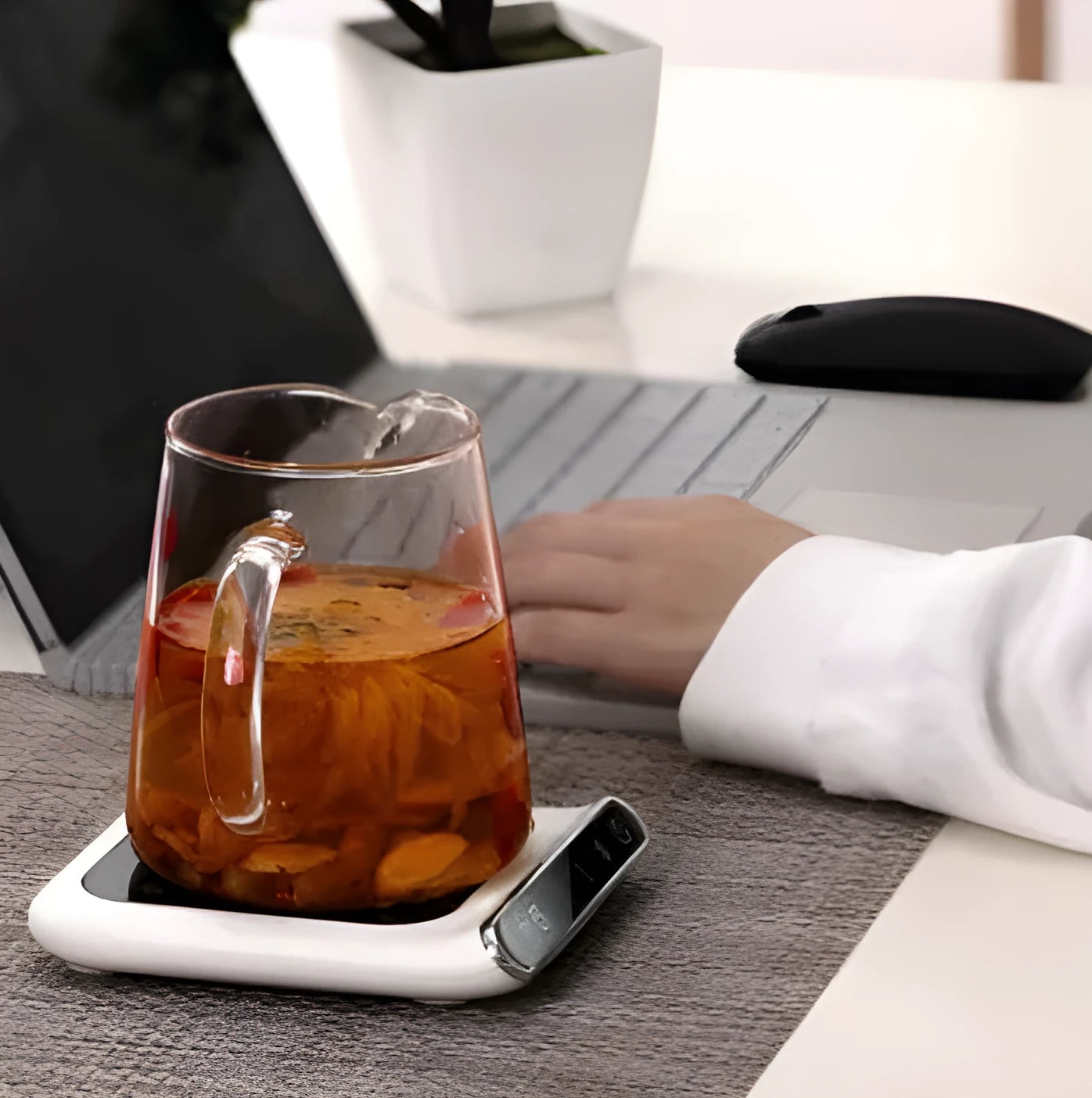 Black USB-powered cup warmer with tempered glass surface showing three temperature control settings