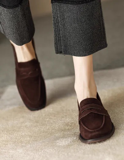 Women's suede leather flat loafers in black or brown, slip-on retro style with low heel under 3cm and top pigskin lining.