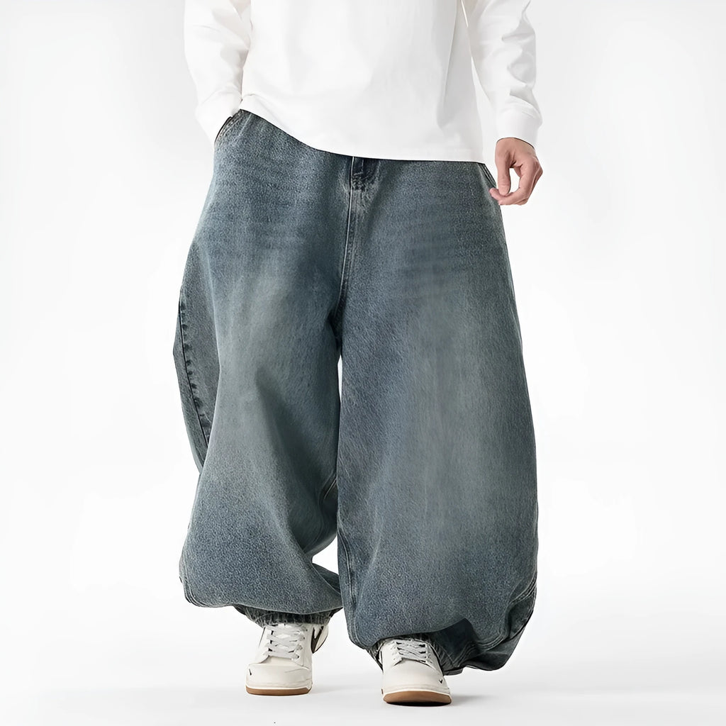 Men's plus size light blue wide leg baggy jeans on a hanger