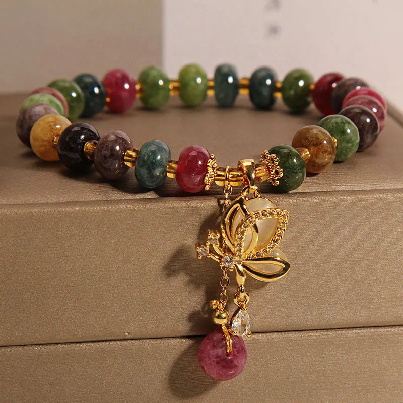 Colourful tourmaline bead and butterfly charm on women's alloy bracelet