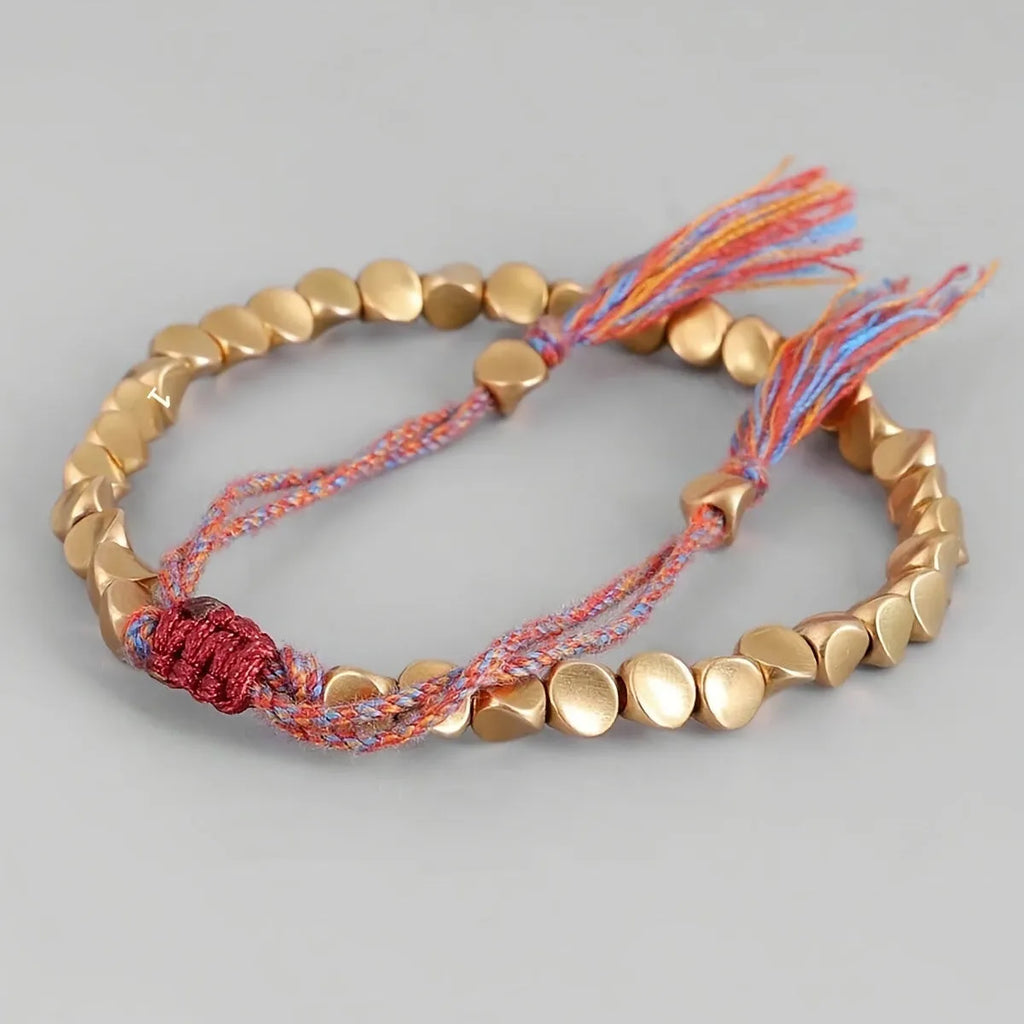 Hand-woven adjustable alloy tassel bracelet in electroplated colour T131 on neutral background