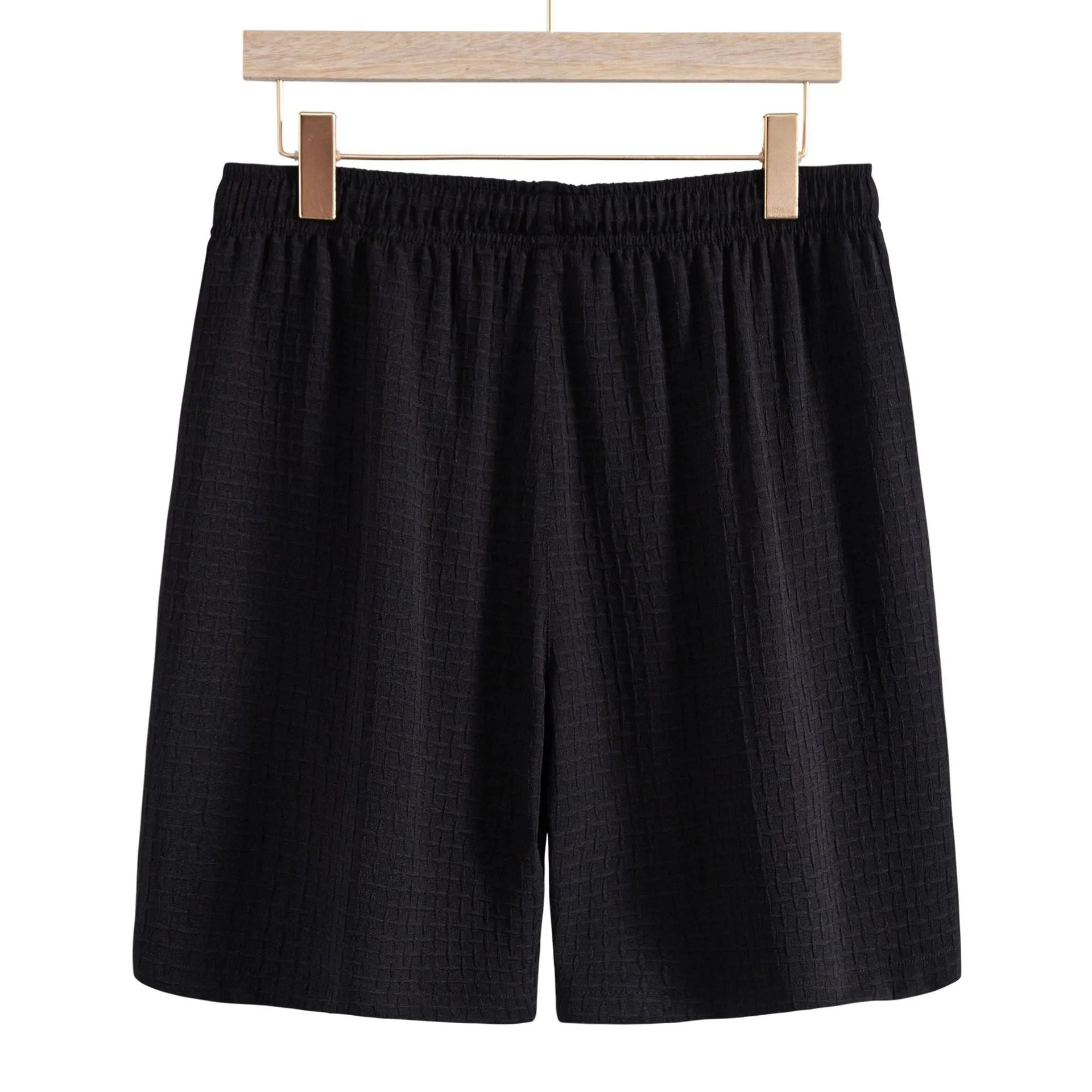 Men's black cotton blend short sleeve shirt and matching shorts laid flat as a summer set.