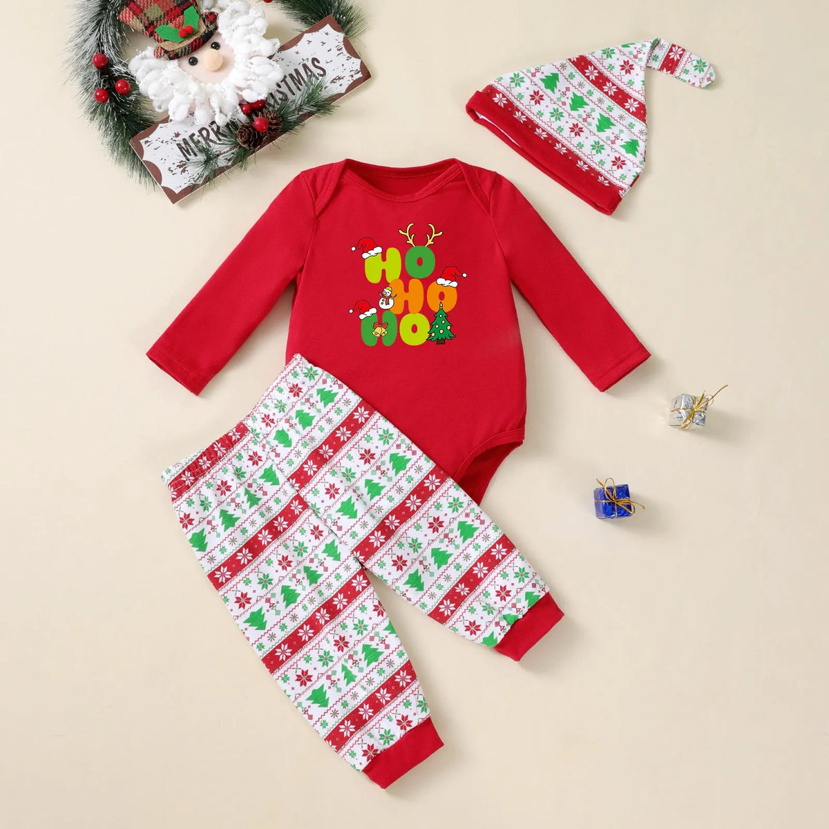 Three-piece Christmas tree print baby outfit with long-sleeve bodysuit, pants, and hat in cotton blend
