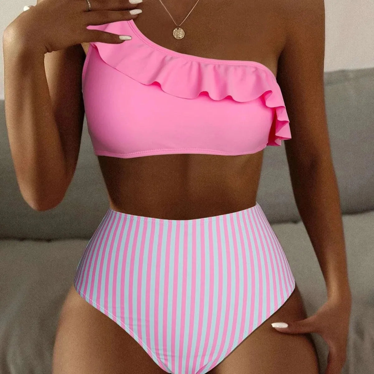 Women's solid colour striped split bikini swimsuit on hanger showing front design