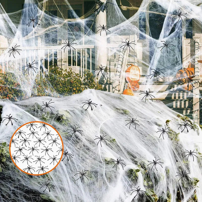 Cotton spider web Halloween decoration set with artificial spiders on dark background