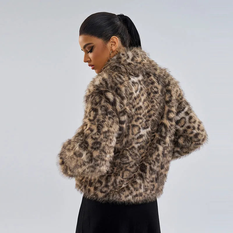 Women's leopard print coat with a buckle lapel on the collar.