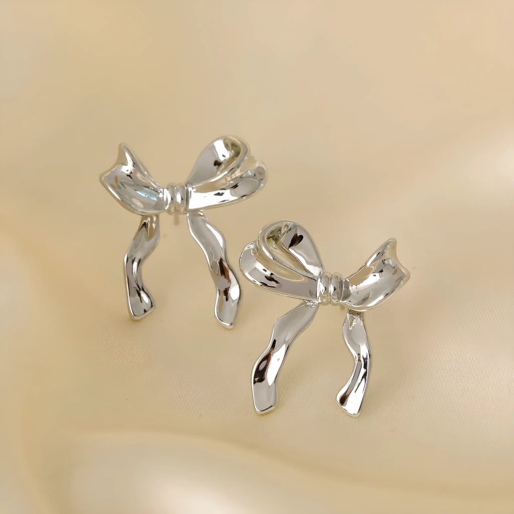 Silver bow earrings for women, copper electroplated, single ear clip and bow ear buckle single, cold wind style