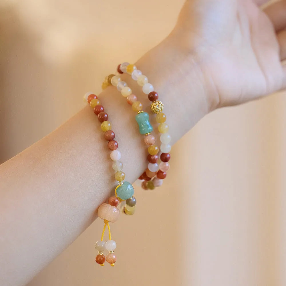 Women's handcrafted three-circle pumpkin jade bracelet with gold tassels