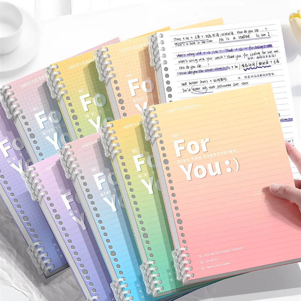 Removable coil gradient notebook with polypropylene cover in blue, green, pink, or purple colours.