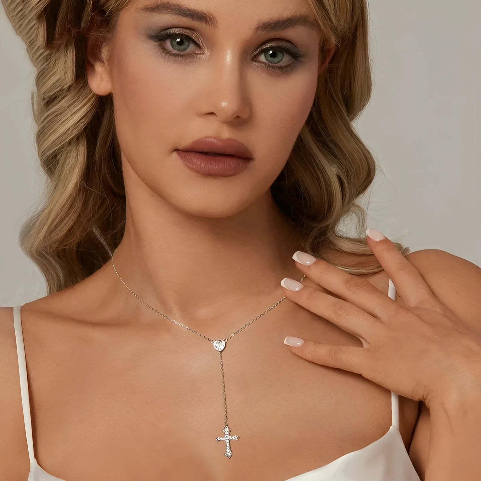 Women's simple V-neck Love cross pendant necklace made from 925 silver on an O-ring chain.