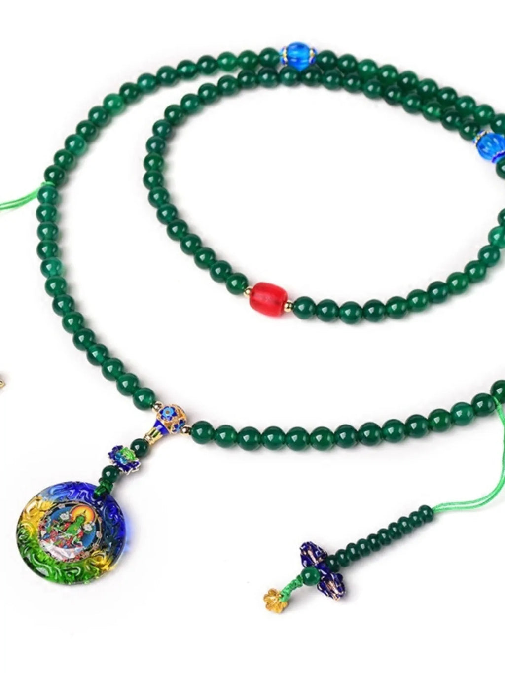Handmade natural green agate 108 bead bracelet with thangka pendant on a wrist.