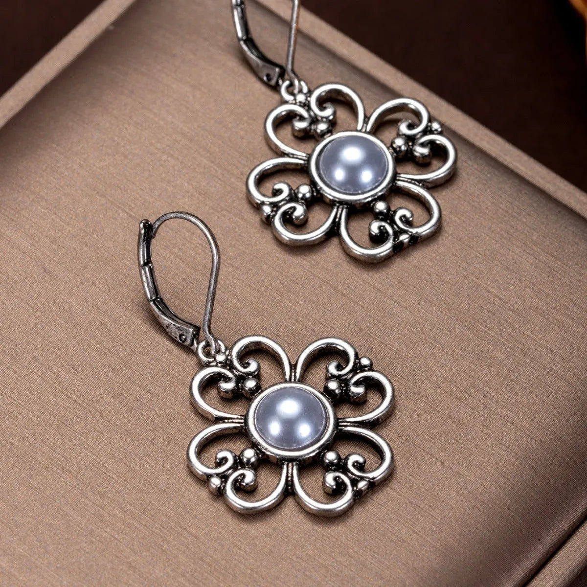 Women's gold-plated retro earrings with inlaid pearl in burnt silver colour