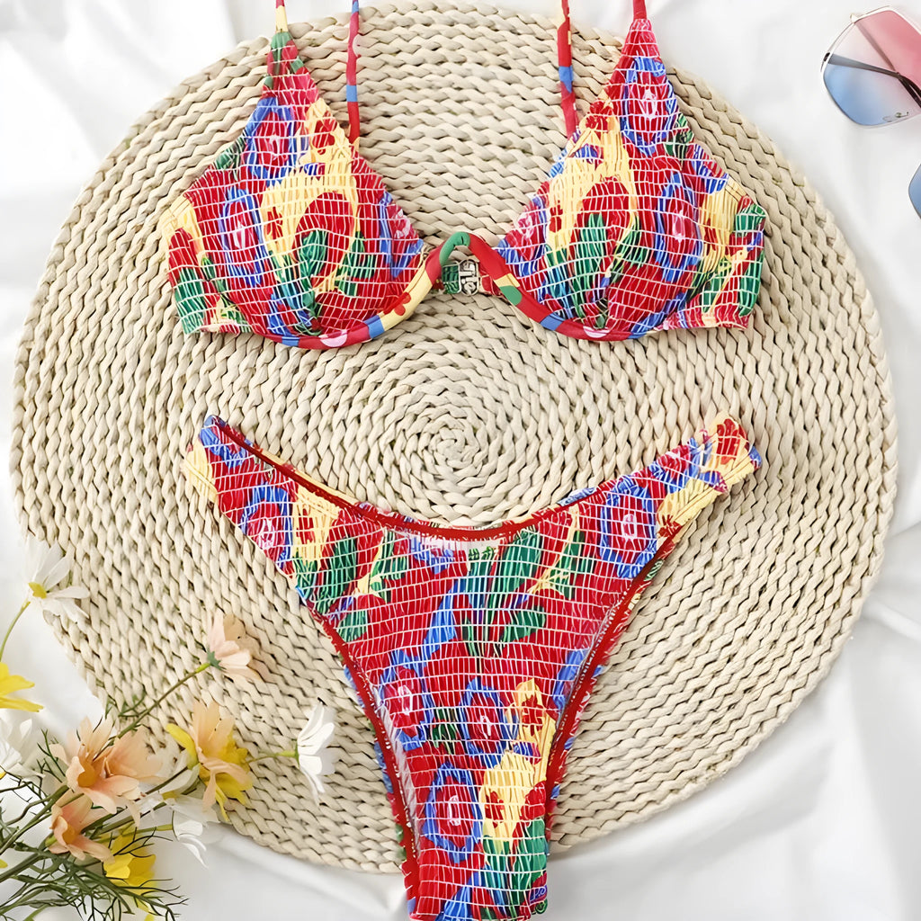 Red floral underwire bikini top and briefs on a white background.