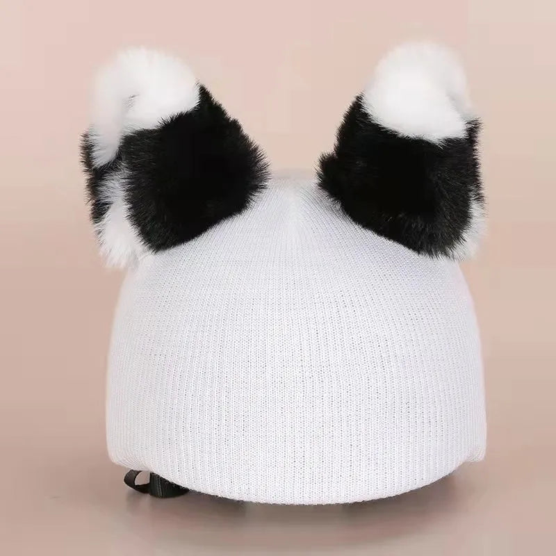 Soft plush cartoon character cover on a motorcycle helmet, showing size M and decorative ear sections.