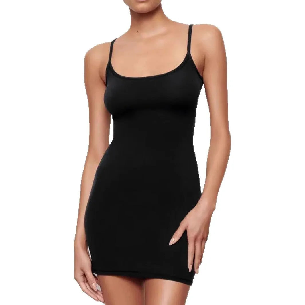 Black sleeveless sling sheath dress on a hanger, showing its mid waist and short skirt.