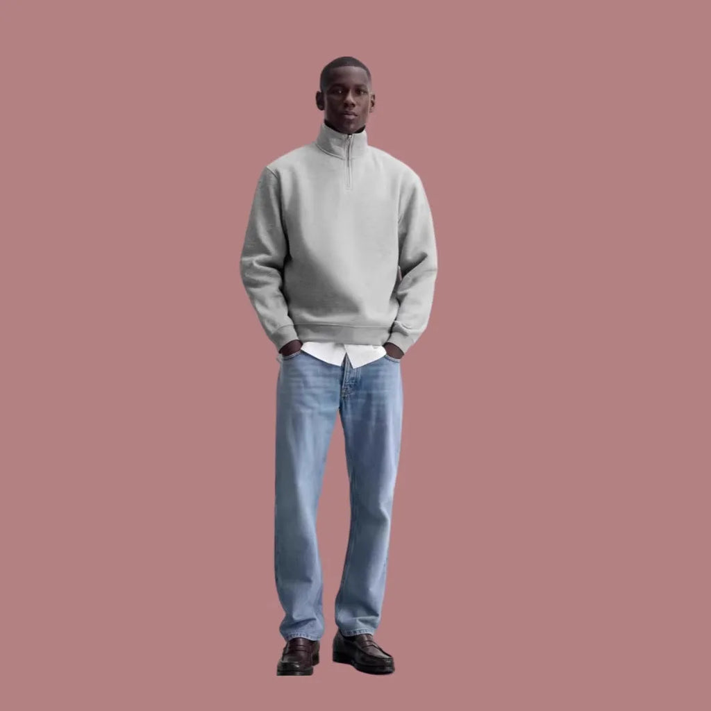 Grey half-zip stand collar cotton sweater with long sleeves on a hanger