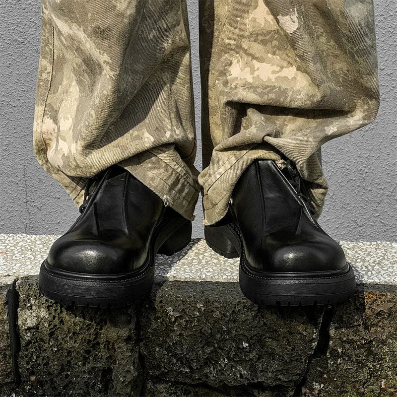 Black platform shoes with round toe and low top design for height enhancement