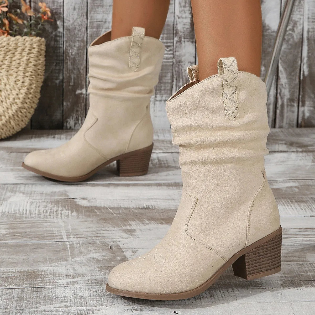Women's mid calf suede boots with a short stout heel in lotus root colour.