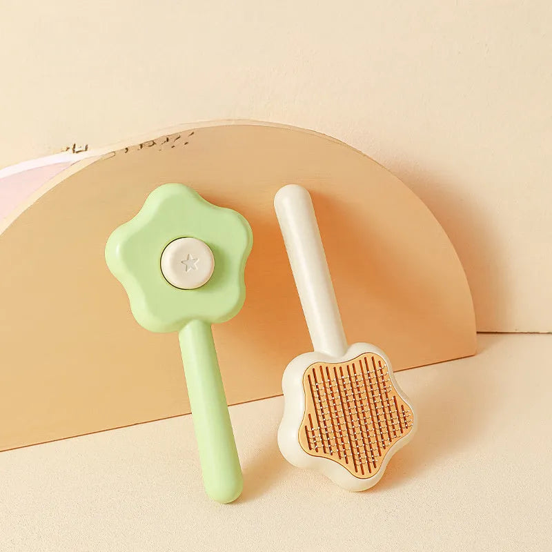 Green self-cleaning cat comb with stainless steel needle teeth and 20 cm handle