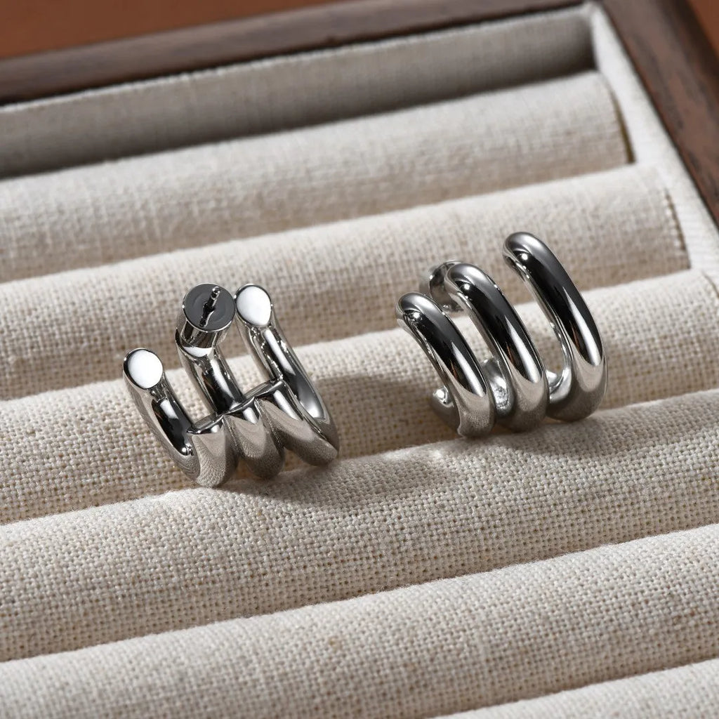 Pair of geometric ear studs for women with sterling silver needles and copper body in gold or silver