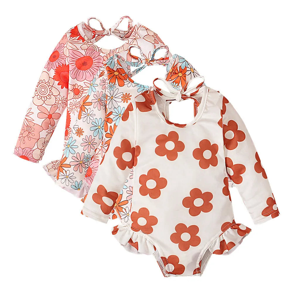 Girl's floral pattern swimsuit with crew neck and open back design in polyester fabric