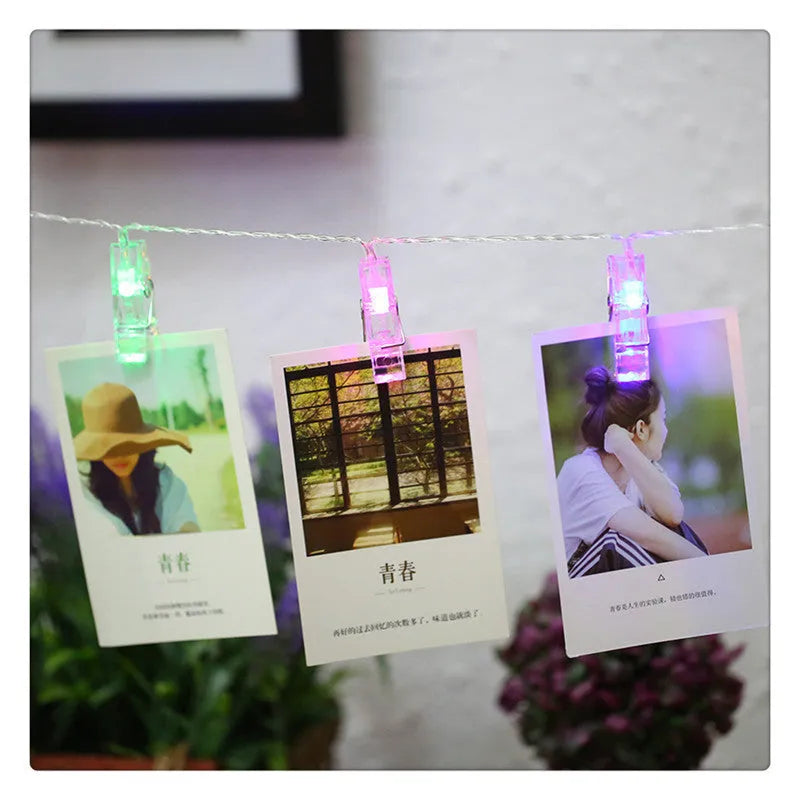 LED heart-shaped clip light string decorating a wedding cake with warm white lights.