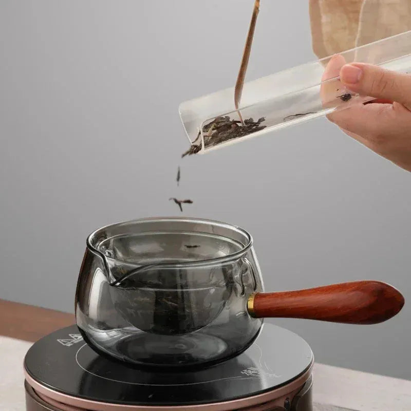 Transparent borosilicate glass teapot with wooden handle and removable infuser for rotary tea brewing