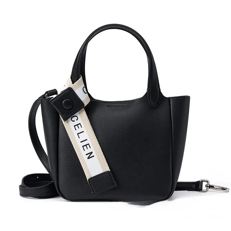 Brown cattlehide leather cross body bucket bag with square vertical design and slit pocket