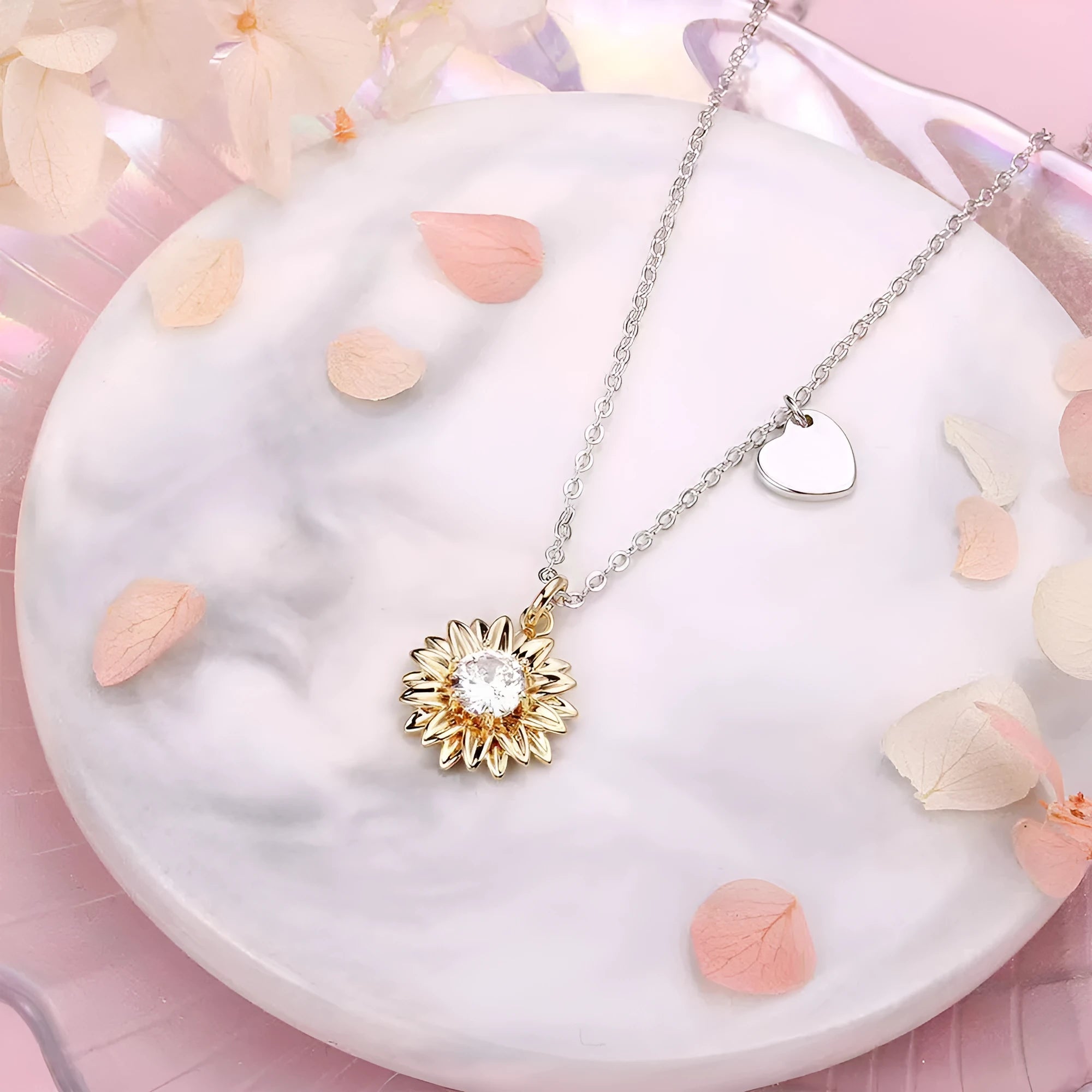 Geometric sunflower daisy pendant necklace on a silver cross chain, adjustable length.