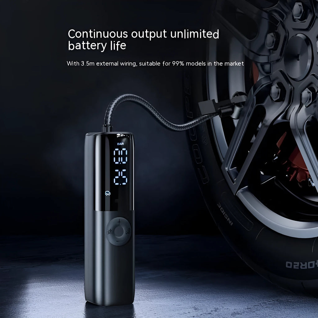 Black portable electric car air pump with tyre pressure gauge and plug connection
