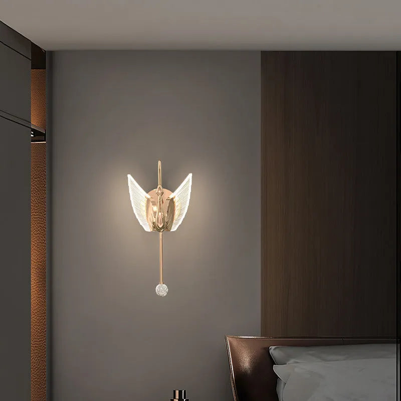 Gold-coloured modern swan-shaped wall lamp with acrylic shade and dimmable multi-colour LED light.