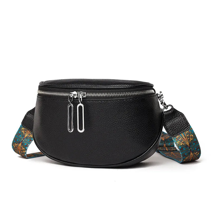 Women's saddle-shaped PU leather messenger bag in black colour with single shoulder strap and sewing line details
