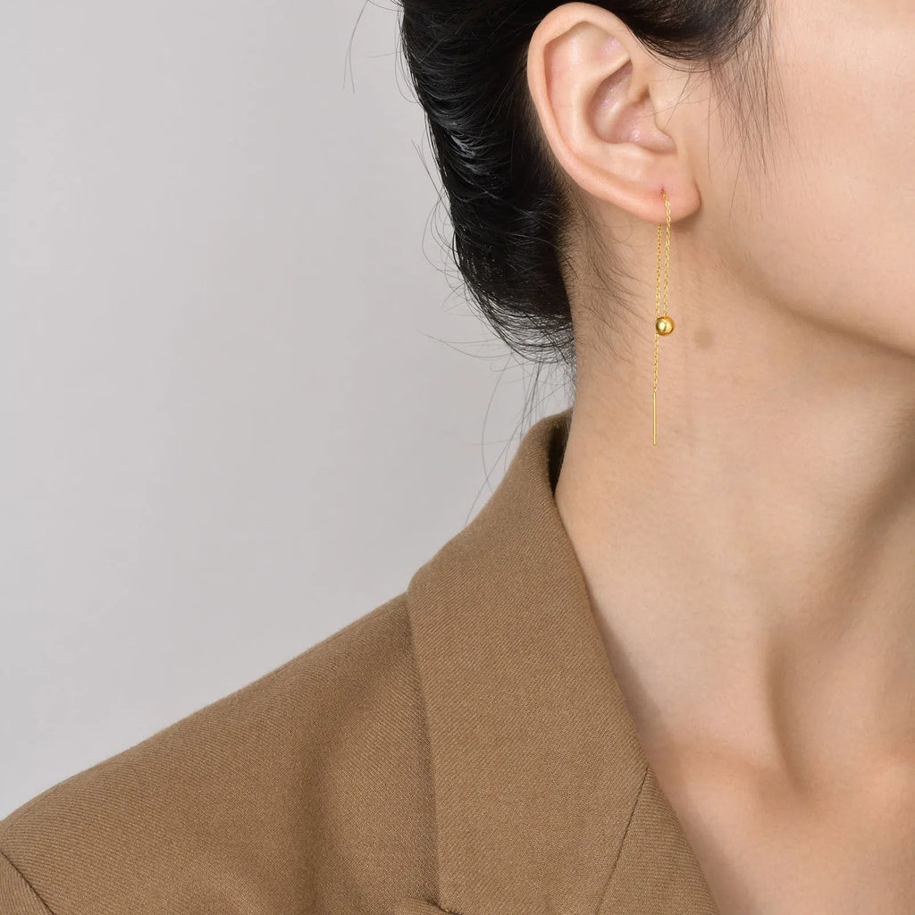 Gold-tone minimalist drop earrings made of alloy with small golden beads for women
