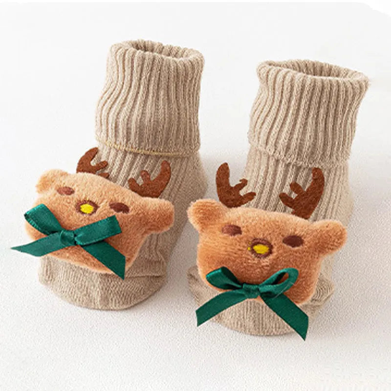Cotton baby socks with non-slip soles in multiple designs including bows, stars, and animal prints.