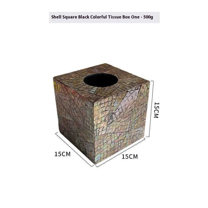 Black rectangular and square natural shell tissue box storage holder on a coffee table.