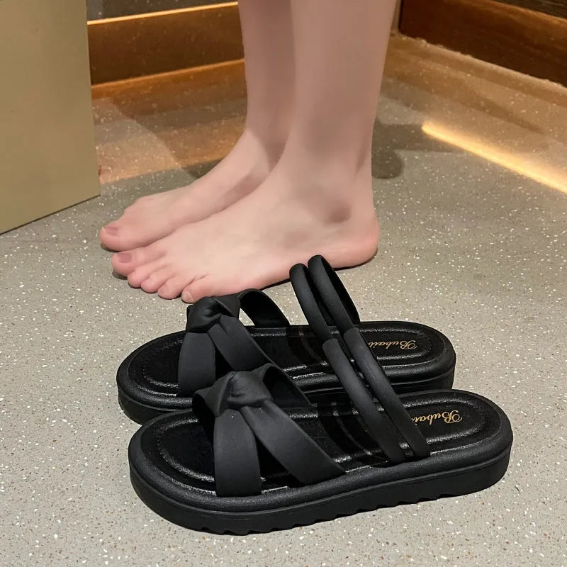 Women's black and white PVC sandals with a soft back, two-way strap design, and a non-slip sole.