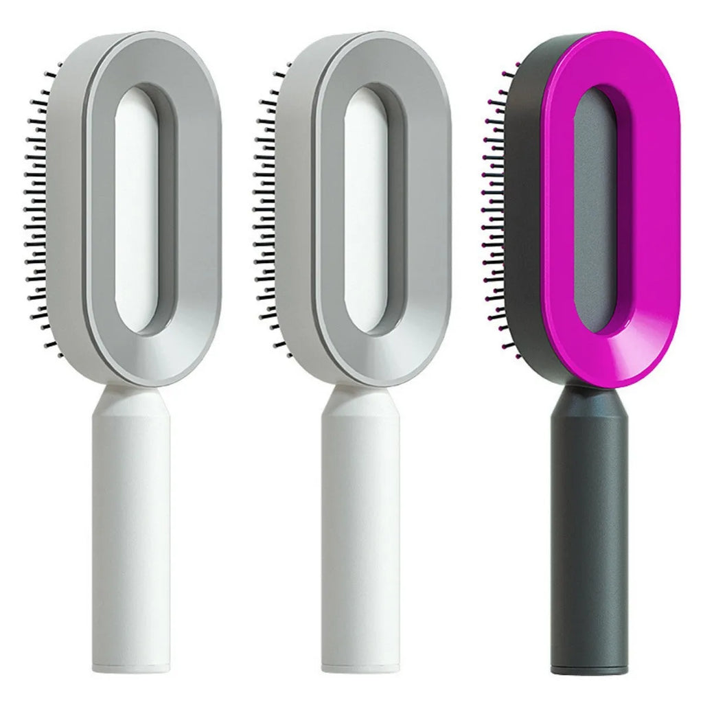 Self-cleaning air cushion hair brush in white, black gold, or black purple with ergonomic handle