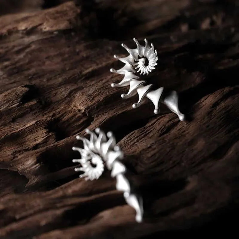 Conch-shaped three-dimensional matte finish alloy ear studs with irregular styling