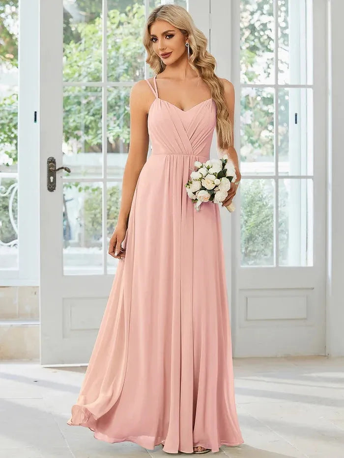 Women's sleeveless sling neck pleated dress in light green with A-line skirt for banquet events
