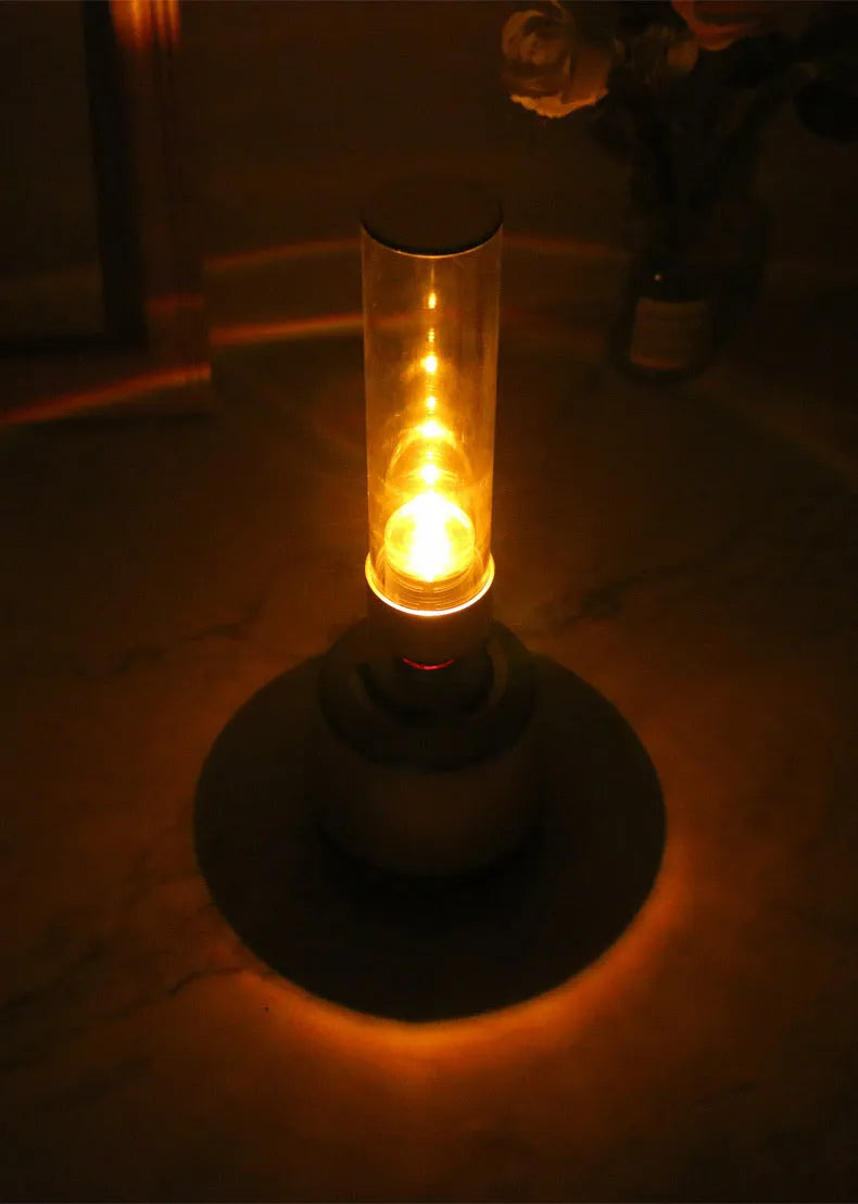 White Silver Candlelight Bluetooth speaker and night light with modern cylindrical design.