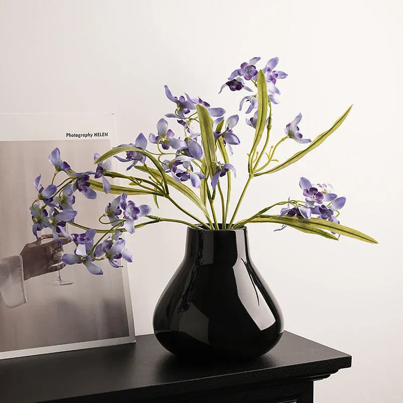Round belly ceramic vase in black or white with optional artificial flowers arrangement
