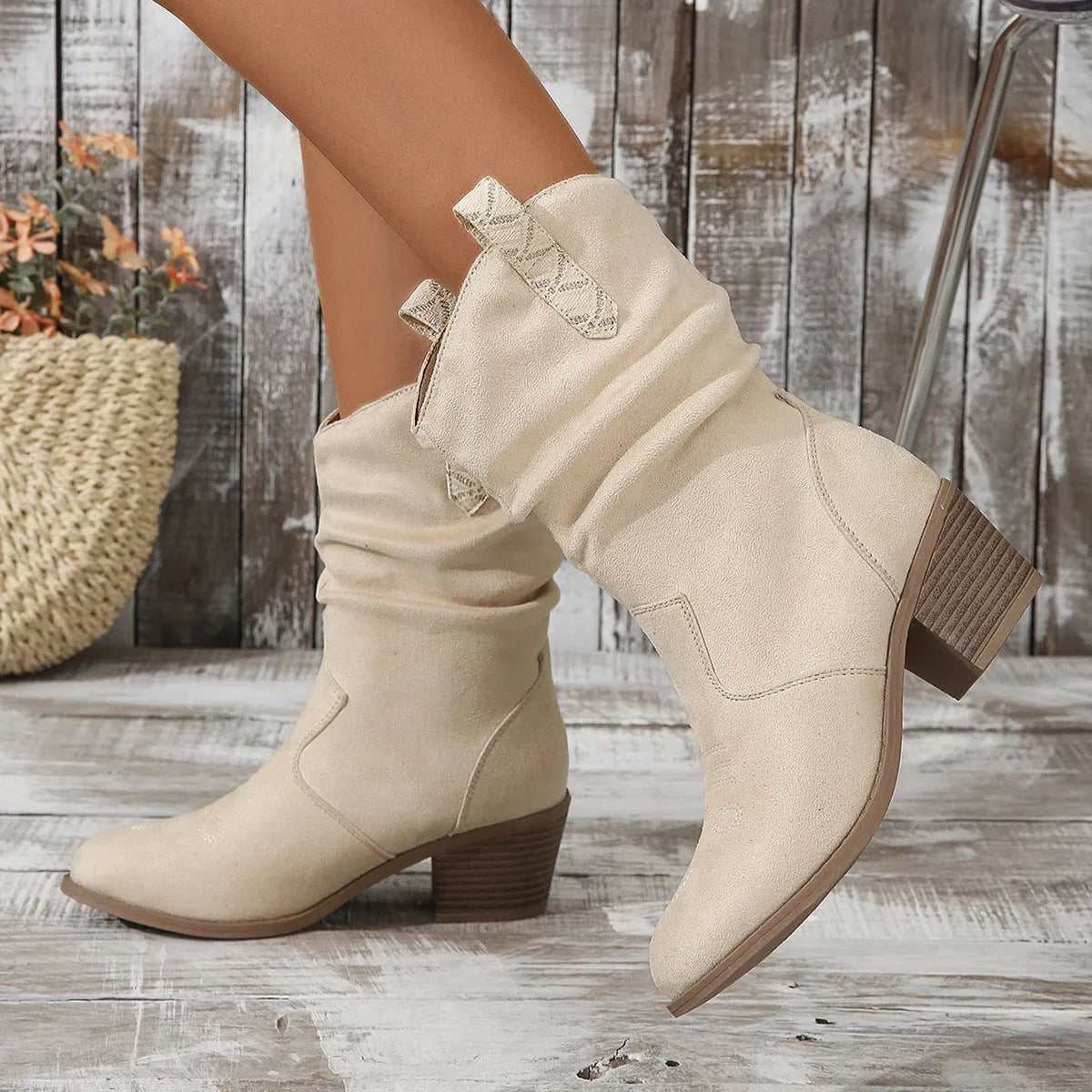 Women's mid calf suede boots with a short stout heel in lotus root colour.