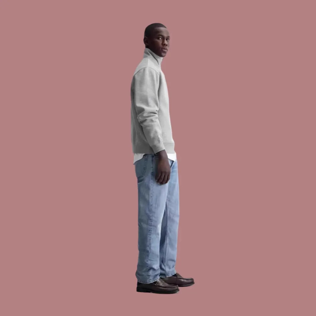 Grey half-zip stand collar cotton sweater with long sleeves on a hanger
