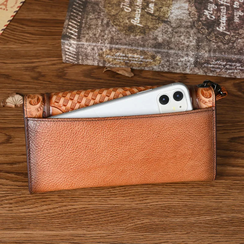 Brown tri-fold women's wallet with Chinese floral embossed pattern on cowhide leather.