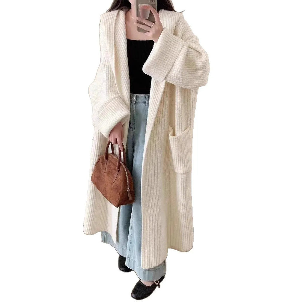 Women's loose grey hooded longline acrylic cardigan coat with raglan sleeves laid flat