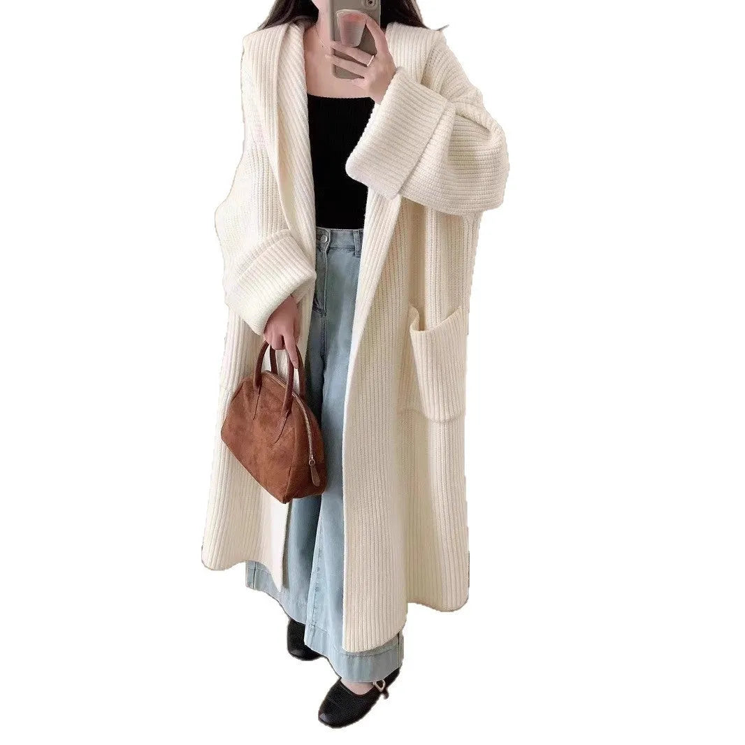 Women's loose grey hooded longline acrylic cardigan coat with raglan sleeves laid flat